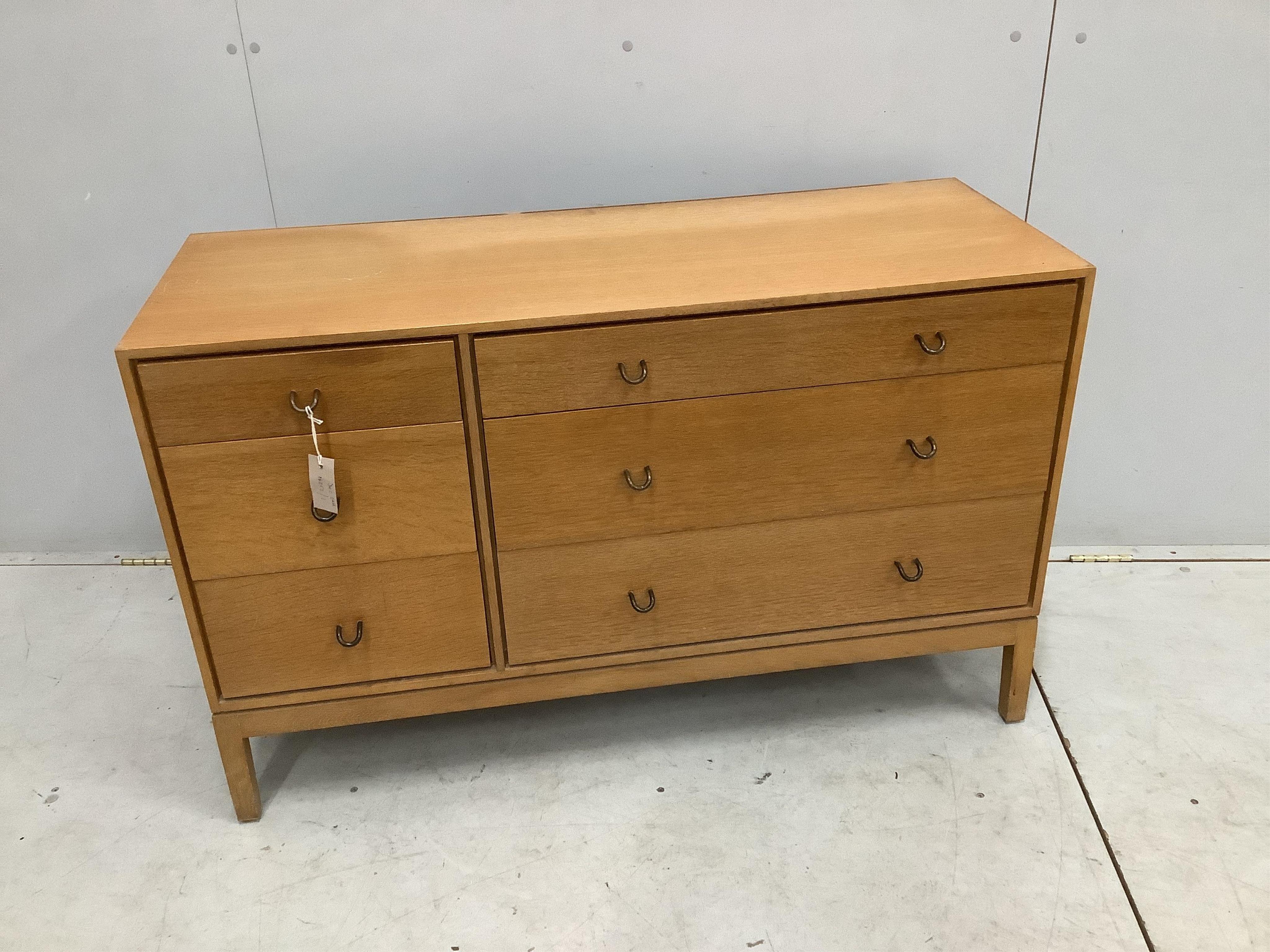 A mid century oak six drawer chest by John and Sylvia Reid, width 112cm, depth 43cm, height 70cm. Condition - fair